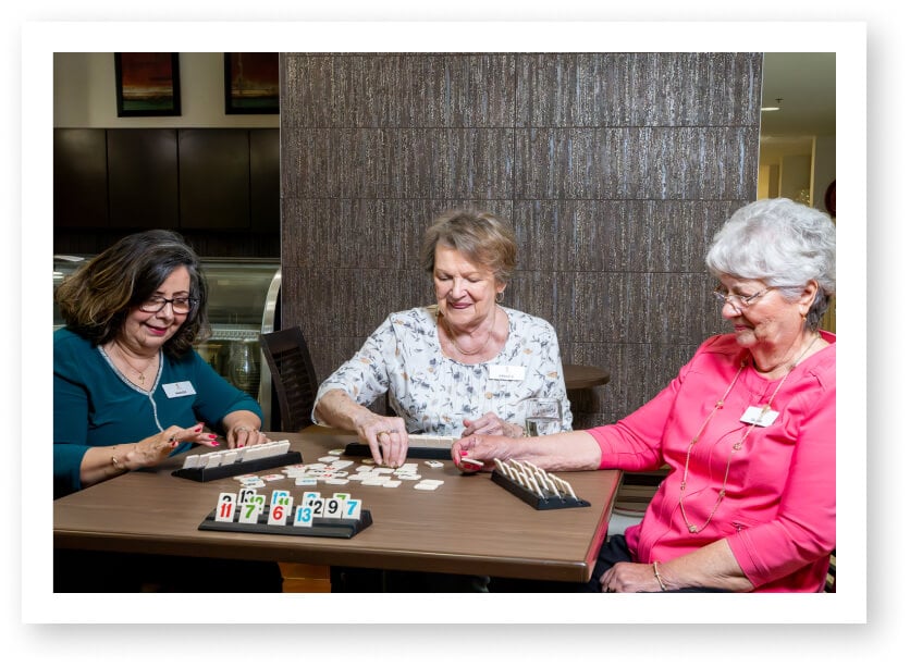 Senior Women Playing Scrabble in Independent Living Facility