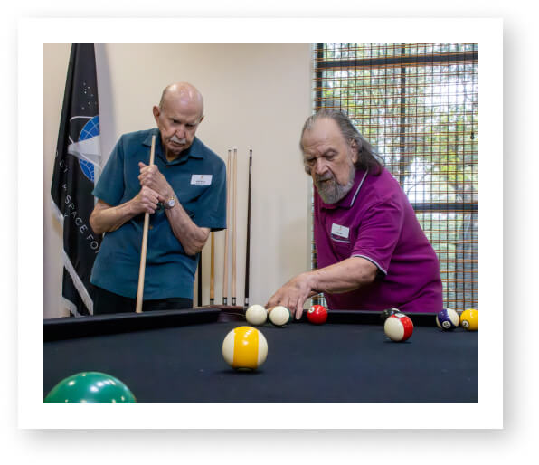 Senior Men Enjoying Their Match of Pool Game at Independent Living Facility