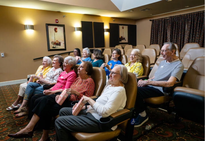 Residents in Independent Living Facility Watching Movie in a Mini Theater Residents in Independent Living Facility Watching Movie in a Mini Theater